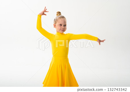 Young dancer with cochlear implant performing dance pose. Strength, adaptability, and inclusion merge in a story of overcoming hearing barriers through art, discipline, and body control. Young dancer with cochlear implant performing dance pose. Strength, adaptability, and inclusion merge in a story of overcoming hearing barriers through art, discipline, and body control. 132743342