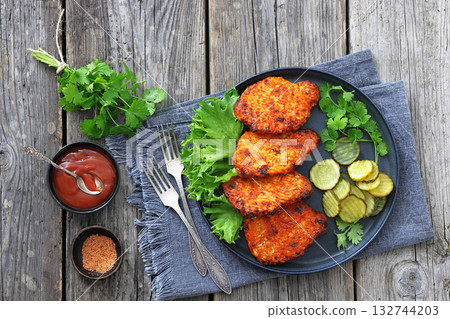 Paprika-Rubbed Pork Chops on a grey plate Paprika-Rubbed Pork Chops on a grey plate 132744203