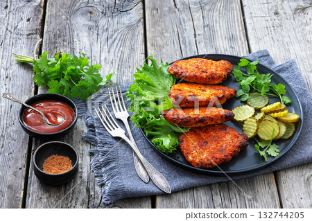 Paprika-Rubbed Pork Chops on a grey plate 132744205