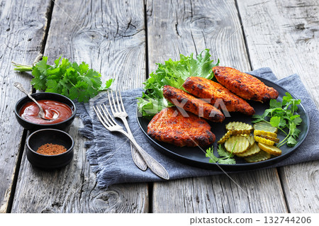 Paprika-Rubbed Pork Chops on a grey plate Paprika-Rubbed Pork Chops on a grey plate 132744206
