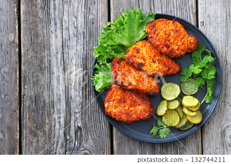 Paprika-Rubbed Pork Chops on a grey plate 132744211