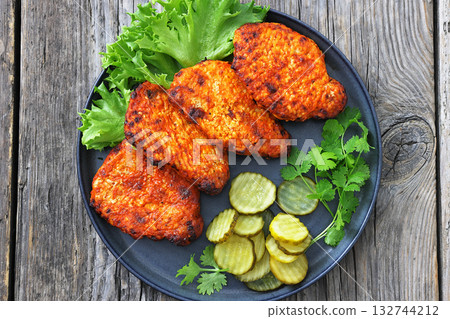 Paprika-Rubbed Pork Chops on a grey plate Paprika-Rubbed Pork Chops on a grey plate 132744212