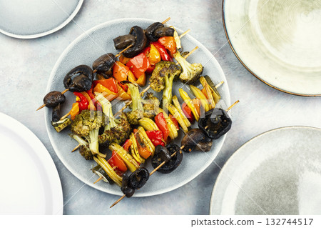 Vegetable skewers with zucchini, bell pepper, and mushroom. Vegetable skewers with zucchini, bell pepper, and mushroom. 132744517