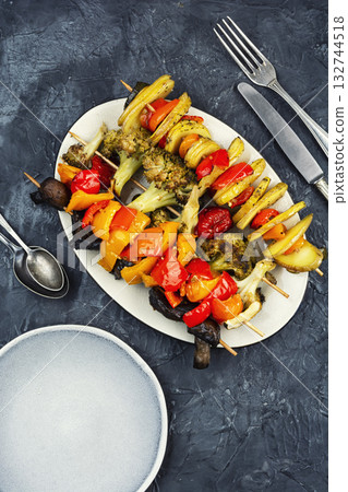Colorful grilled summer seasonal vegetables skewers. Colorful grilled summer seasonal vegetables skewers. 132744518