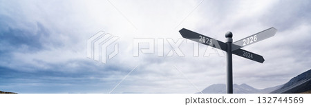 Directional road sign with the upcoming years 2024, 2025, and 2026 with a blue sky background. Happy New Year concept or Celebration Directional road sign with the upcoming years 2024, 2025, and 2026 with a blue sky background. Happy New Year concept or Celebration 132744569