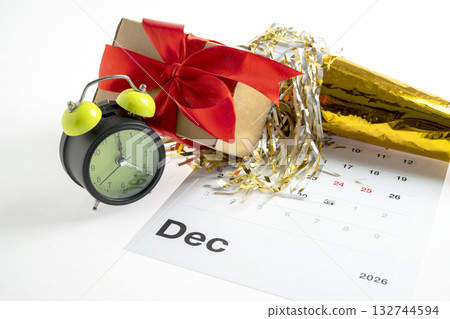 Calendar showing 1st January 2026 as the new year with an alarm clock, party horn, and gift box. Happy New Year concept or Celebration Calendar showing 1st January 2026 as the new year with an alarm clock, party horn, and gift box. Happy New Year concept or Celebration 132744594