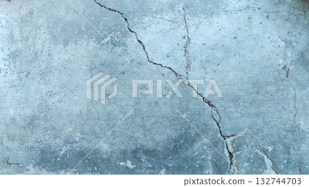 A crack in the concrete floor surface, providing texture for the background 132744703