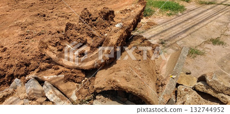 Broken Pipe Lying on the Ground - Horizontal Broken Pipe Lying on the Ground - Horizontal 132744952
