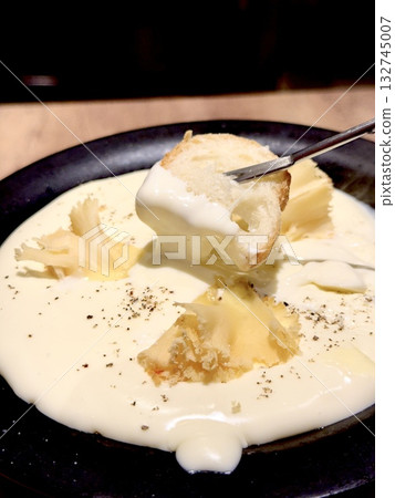 Cheese fondue at a restaurant 132745007