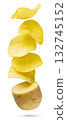 Potato chips flying out of a raw potato on a white background. Isolated 132745152
