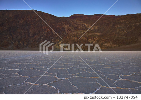 Salt Flats and Mountain Landscape at Twilight in Death Valley 132747054