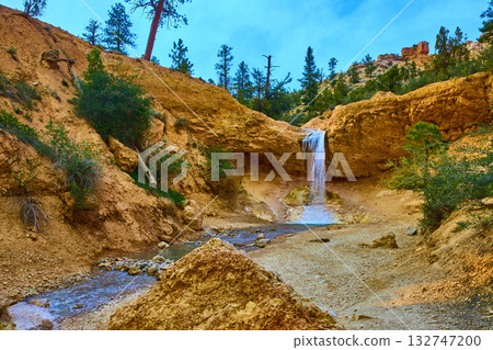 Waterfall Flowing Over Sandstone Cliffs and Stream on Mossy Cave Trail 132747200