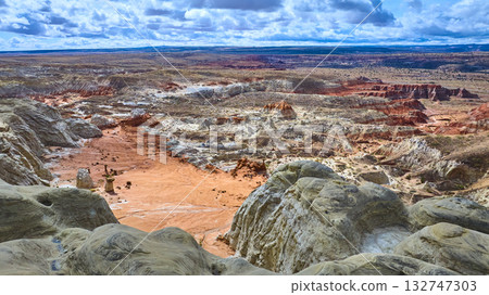 Aerial Badlands and Toadstool Hoodoos Over Colorful Desert Rock Formations 132747303