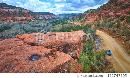 Aerial Red Sandstone Cliffs Winding Road Blue Car Kanab Utah 132747305