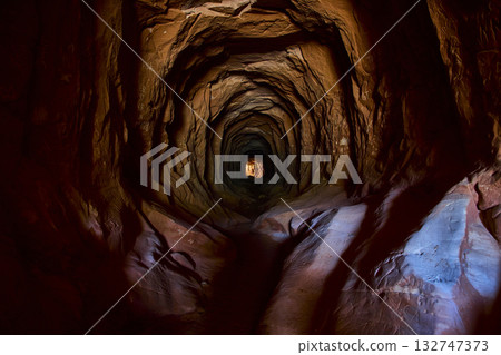 Rocky Tunnel Interior with Graffiti and Sunlight Shaft Belly of the Dragon Kanab Rocky Tunnel Interior with Graffiti and Sunlight Shaft Belly of the Dragon Kanab 132747373