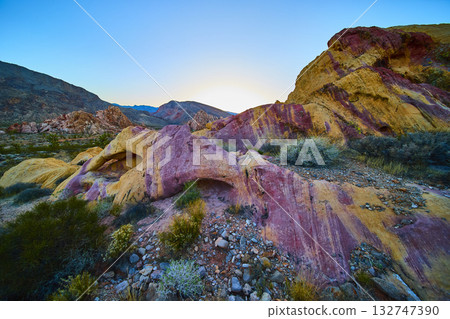 Colorful Sandstone Formations and Neapolitan Arch at Sunset in Desert Landscape Colorful Sandstone Formations and Neapolitan Arch at Sunset in Desert Landscape 132747390