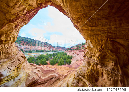 Sandstone Cave Walls Framing Green Valley and Red Cliffs Kanab Utah Sandstone Cave Walls Framing Green Valley and Red Cliffs Kanab Utah 132747396