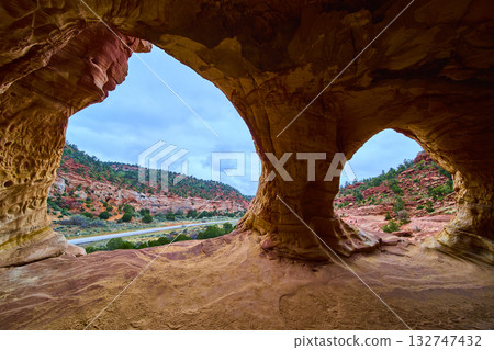 Sandstone Cave Openings Over Desert Highway and Cliffs Kanab Utah Sandstone Cave Openings Over Desert Highway and Cliffs Kanab Utah 132747432