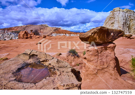 Paria Rimrocks Toadstool Hoodoo with Rainwater Pool and Dramatic Sky Utah Paria Rimrocks Toadstool Hoodoo with Rainwater Pool and Dramatic Sky Utah 132747559