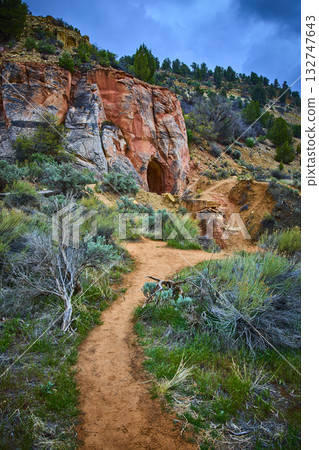 Desert Hiking Trail Leading to Sandstone Cliff and Cave Belly of the Dragon Utah 132747643