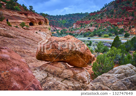 Balanced Red Rock Boulder and Sand Caves with Winding Road in Kanab Utah 132747649
