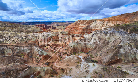 Aerial Canyon Landscape with Layered Red Rock Formations and Hikers Utah Desert 132747667