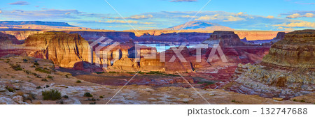 Sandstone Cliffs and Lake Powell with Distant Mountains at Golden Hour Panorama Sandstone Cliffs and Lake Powell with Distant Mountains at Golden Hour Panorama 132747688