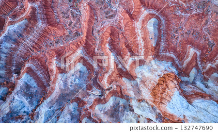 Aerial Top Down Red and White Sandstone Striations Desert Erosion Patterns 132747690