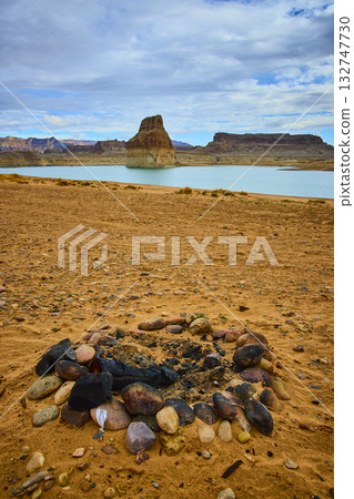 Campfire Ring on Desert Shore with Lone Rock and Lake Powell Waters Campfire Ring on Desert Shore with Lone Rock and Lake Powell Waters 132747730