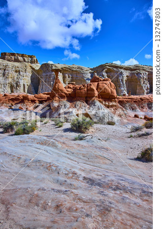 Toadstool Hoodoo Rock Formations and Layered Cliffs in Utah Desert Under Blue Sky Toadstool Hoodoo Rock Formations and Layered Cliffs in Utah Desert Under Blue Sky 132747803
