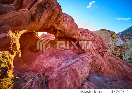 Red Sandstone Arch Formation with Textured Rocks and Blue Sky Red Sandstone Arch Formation with Textured Rocks and Blue Sky 132747825