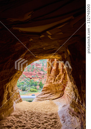 Sandstone Cave Interior Framing Desert Road and Red Cliffs Kanab Utah 132748000