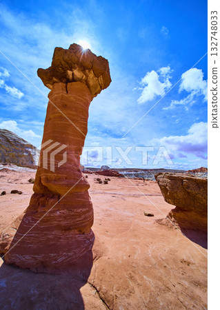 Sandstone Hoodoo with Sunburst at Toadstool Hoodoos Utah Desert Landscape Sandstone Hoodoo with Sunburst at Toadstool Hoodoos Utah Desert Landscape 132748033