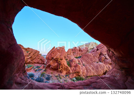 Red Rock Arch Formation and Rugged Desert Landscape under Clear Blue Sky Red Rock Arch Formation and Rugged Desert Landscape under Clear Blue Sky 132748096