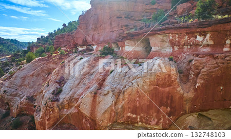Aerial Red Rock Cliffs and Green Desert Vegetation Kanab Utah Sand Caves Aerial Red Rock Cliffs and Green Desert Vegetation Kanab Utah Sand Caves 132748103