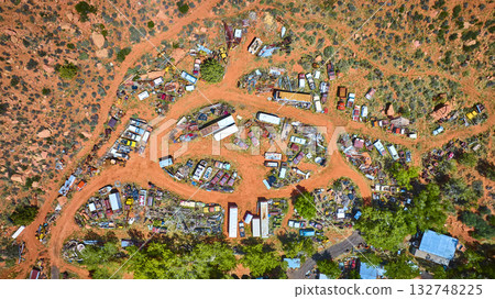 Aerial Junkyard and Abandoned Vehicles in Desert Landscape Utah 132748225