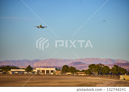 Airplane taxiing at Las Vegas airport Nevada terminal with city skyline in background Airplane taxiing at Las Vegas airport Nevada terminal with city skyline in background 132748241