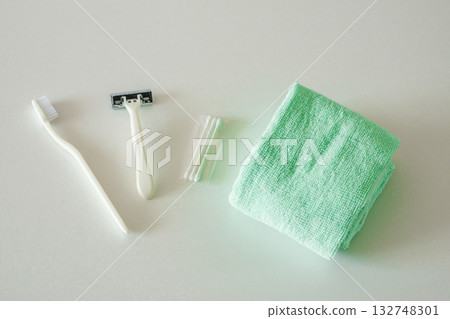toiletries on the table, toothbrush, razor, ear sticks, towel toiletries on the table, toothbrush, razor, ear sticks, towel 132748301