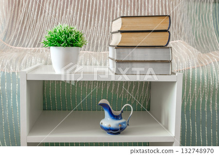 books, flower, vase on white bookcase books, flower, vase on white bookcase 132748970