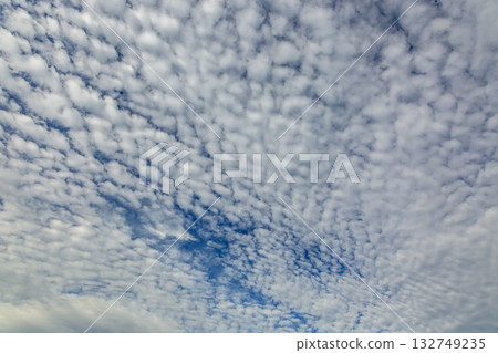 The shape of altocumulus clouds, also known as sheep clouds, spreading across the sky The shape of altocumulus clouds, also known as sheep clouds, spreading across the sky 132749235