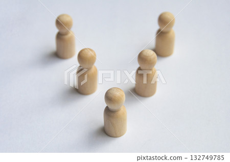 Top view of wooden pegs following a leader Top view of wooden pegs following a leader 132749785