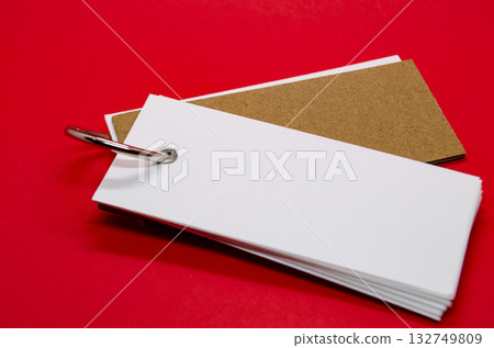 White banner shape notepad with customizable space for text on red cover background. 132749809