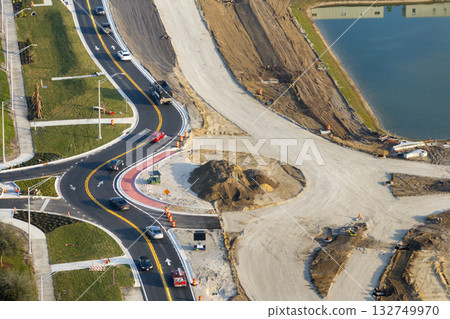 Aerial view of busy American highway road under construction. Development of roundabout traffic infrastructure. State transportation concept Aerial view of busy American highway road under construction. Development of roundabout traffic infrastructure. State transportation concept 132749970