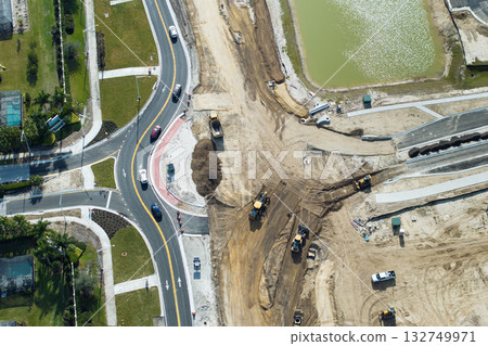 Aerial view of busy American highway road under construction. Development of roundabout traffic infrastructure. State transportation concept 132749971