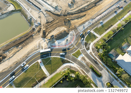 Aerial view of busy American highway road under construction. Development of roundabout traffic infrastructure. State transportation concept 132749972