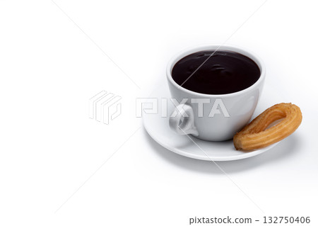 Spanish churros with hot thick chocolate in a white cup 132750406