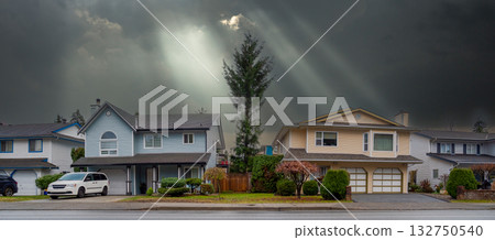 Row of residential houses on stormy sky background 132750540