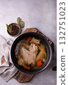 Chicken broth soup or bouillon in pan 132751023