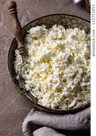 Cottage cheese on light background Cottage cheese on light background 132751053