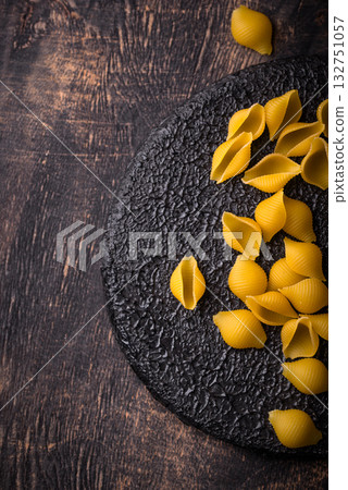 Raw pasta in shape of shells Raw pasta in shape of shells 132751057